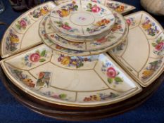 Pottery lazy susan on wooden tray with a floral design, the base marked "T Goode & Co, South