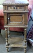Late Victorian walnut bedside stand with rouge marble inset top above a drawer and door, open