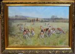 Charles Clifford Turner, Hounds on the chase, oil on board, signed lower right, 49 x 74cm