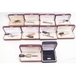 Mixed Lot: nine cased tie-clips, one silver example, eight plated examples, some set with lapis,