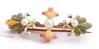 Antique enamel and seed pearl brooch featuring three graduated seed pearls set within translucent