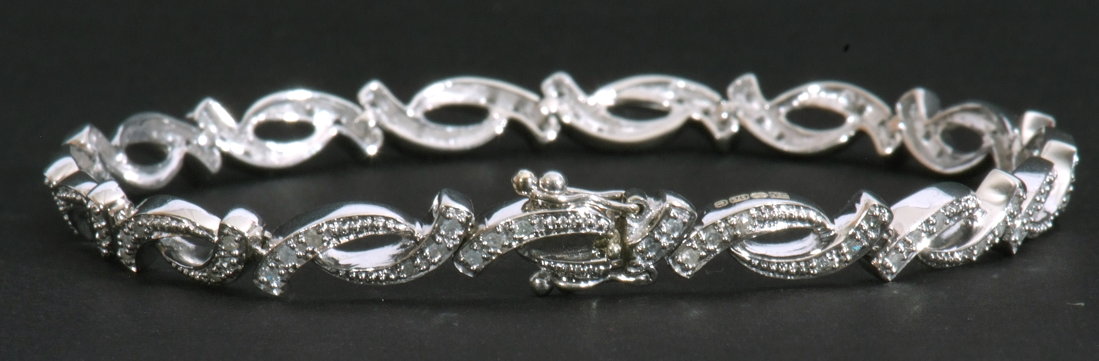 Modern small diamond set bracelet, an oval link design, each with three small graduated diamonds, - Image 3 of 6