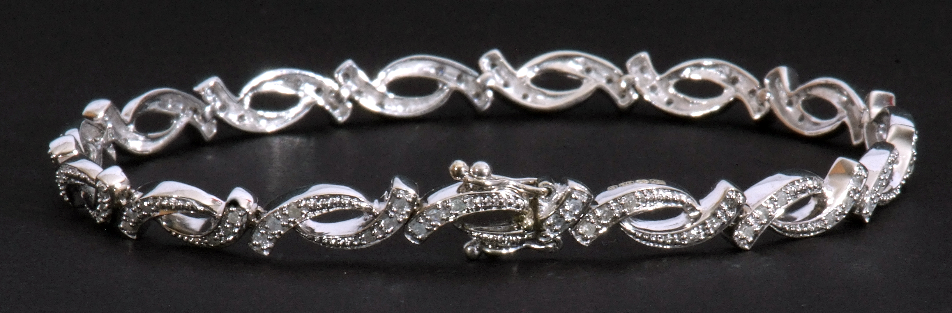 Modern small diamond set bracelet, an oval link design, each with three small graduated diamonds, - Image 2 of 6