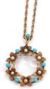 Early 20th century 15ct stamped turquoise and seed pearl open work pendant, a design of a garland of