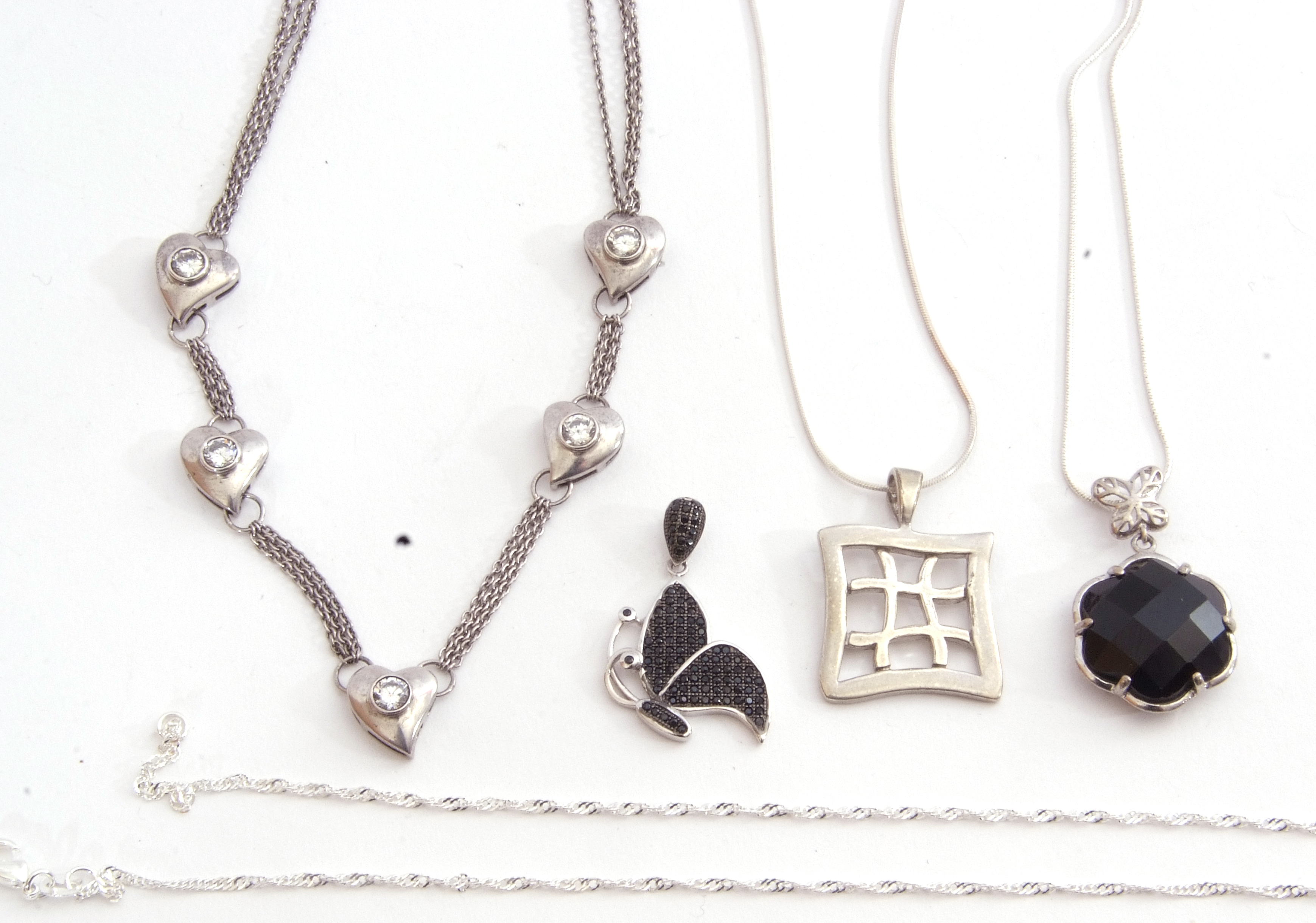 Mixed Lot: Two 925 stamped pendants on chains, each with black stone decoration, a pierced square - Image 2 of 2