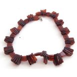 Modern cognac amber bead choker style necklace, a design featuring large ribbed beads interspersed