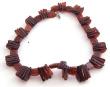 Modern cognac amber bead choker style necklace, a design featuring large ribbed beads interspersed