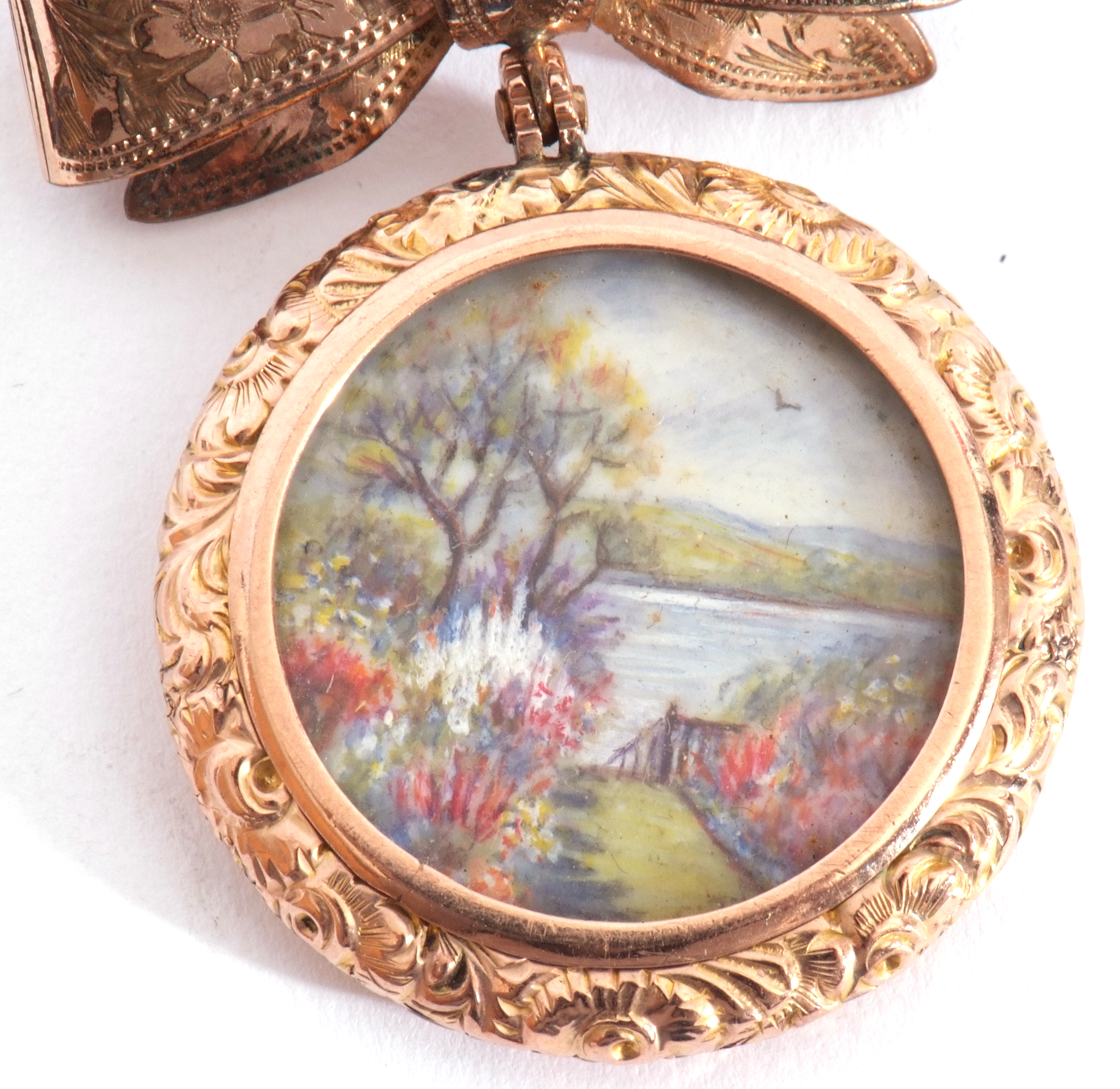 Antique double sided locket, one side painted with a garden river view scene, in ornate chased and - Image 2 of 4