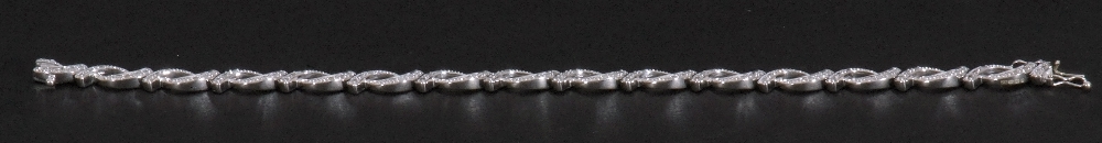 Modern small diamond set bracelet, an oval link design, each with three small graduated diamonds, - Image 5 of 6