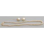 Mixed Lot: a cultured pearl single row necklace with a diamond set clasp, 4mm-1mm (graduated),