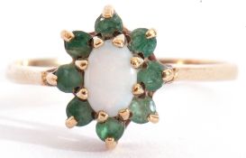 Modern 9ct gold opalescent and emerald cluster ring, the oval cabochon centre opalescent within a