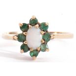 Modern 9ct gold opalescent and emerald cluster ring, the oval cabochon centre opalescent within a