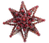 Early 20th century Bohemian costume garnet set starburst brooch, various sizes and shaped small deep