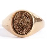 9ct gold gent"s Masonic ring, the oval centre chased and engraved with a compass and ruler motif