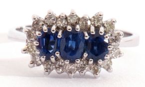 18ct white gold, blue stone and diamond ring centring three graduated oval faceted blue stones