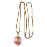 Vintage gilt metal and pink glass lantern pendant suspended on a gilt metal Byzantine chain