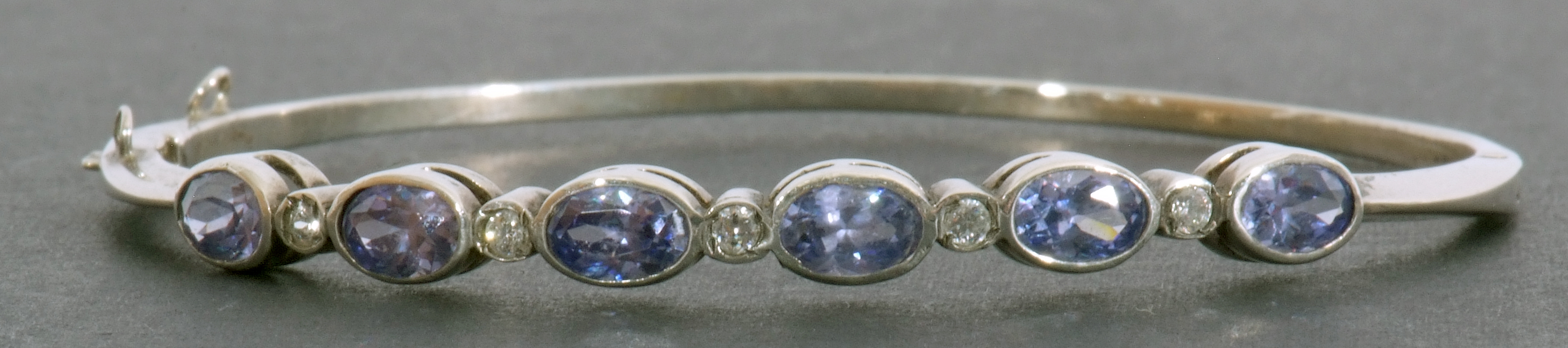 Modern pale sapphire and diamond set hinged bracelet, featuring six oval faceted pale sapphires in - Image 2 of 6