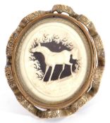 Late 19th century carved ivory brooch, the inner carved with a horse amongst trees in an ornate