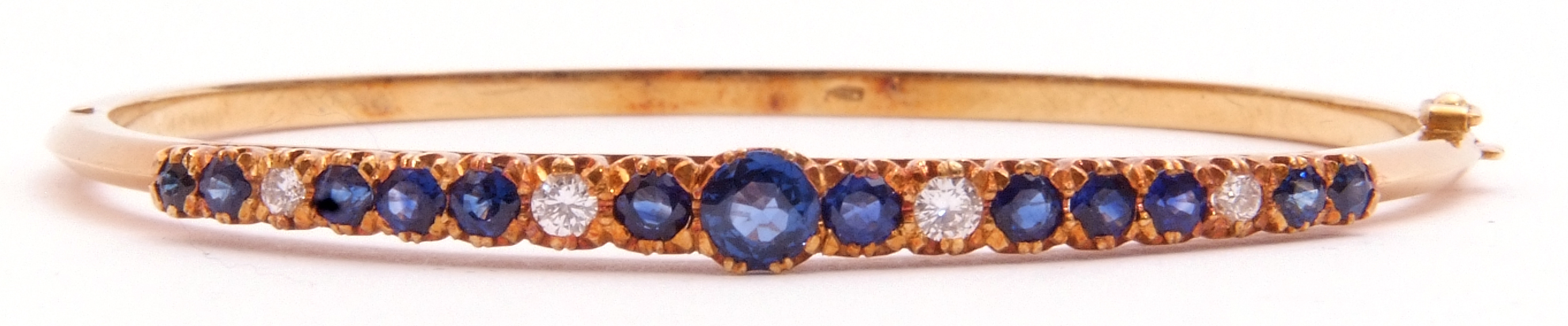 Sapphire and diamond hinged bracelet, the raised pierced gallery set with 13 round faceted sapphires - Image 2 of 6