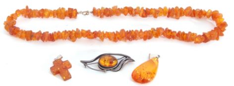 Mixed Lot: amber fragment necklace, two pendants and a brooch (4)