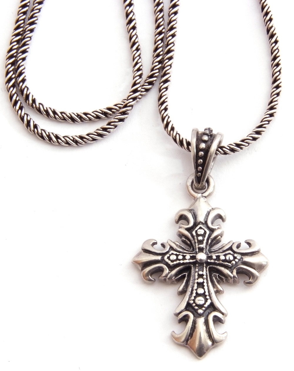 A 925 marked Gothic cross pendant suspended from a rope twist line chain, stamped 925, 26gms g/w