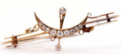 Vintage yellow metal and diamond crescent brooch, the triple knife edge bars centring a brilliant