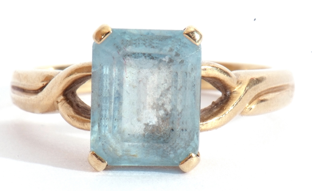 9ct gold modern blue stone ring, rectangular shaped stepped cut, raised between pierced shoulders, - Image 7 of 7