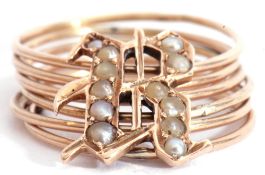 Modern yellow metal multi-band day ring featuring six separate bands supplied with a seed pearl