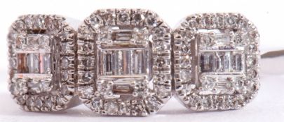 Modern 9ct white gold and diamond cluster ring, a design featuring three shaped square panels,