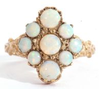 9ct gold opalescent cluster ring of lozenge shape, featuring nine graduated round cut opalescents,