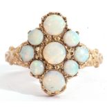 9ct gold opalescent cluster ring of lozenge shape, featuring nine graduated round cut opalescents,