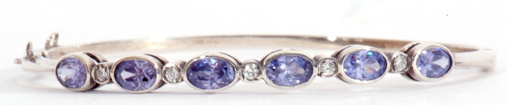 Modern pale sapphire and diamond set hinged bracelet, featuring six oval faceted pale sapphires in - Image 3 of 6