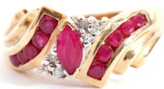 Modern 10K stamped ruby and diamond ring centring a lozenge shaped ruby highlighted with six small