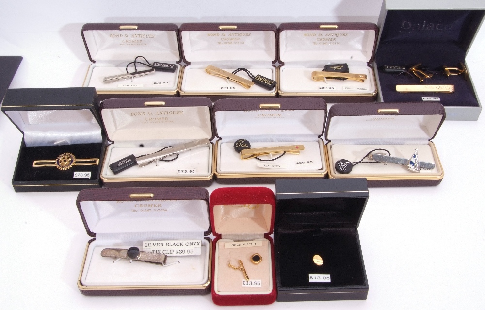 Mixed Lot: nine cased gent"s tie-clips, silver, onyx examples, three chrome, four gold plated,