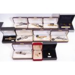 Mixed Lot: nine cased gent"s tie-clips, silver, onyx examples, three chrome, four gold plated,