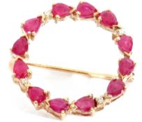 9ct gold ruby and diamond brooch, a garlanded design with groups of three pear shaped rubies,