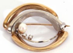 Modern stylised two-tone brooch highlighted with a cultured pearl and two small diamonds, stamped