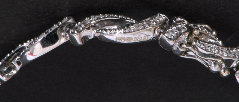 Modern small diamond set bracelet, an oval link design, each with three small graduated diamonds, - Image 4 of 6