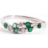 Modern precious metal diamond and emerald ring, alternate entwined design featuring 4 small