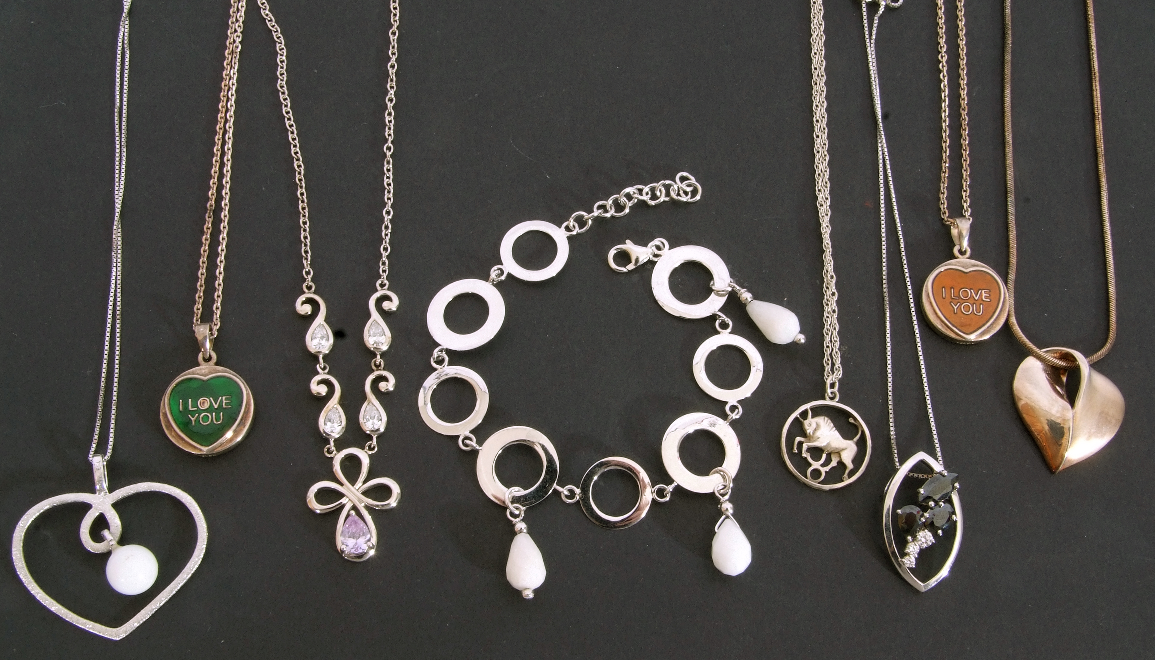 Mixed Lot: white metal jewellery to include four heart pendant necklaces, disc and bead bracelet, - Image 2 of 2