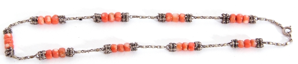 Vintage white metal and coral bead necklace, each section with three coral beads, capped with two