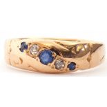 Late Victorian 18ct gold sapphire and diamond ring, alternate set with three graduated round cut