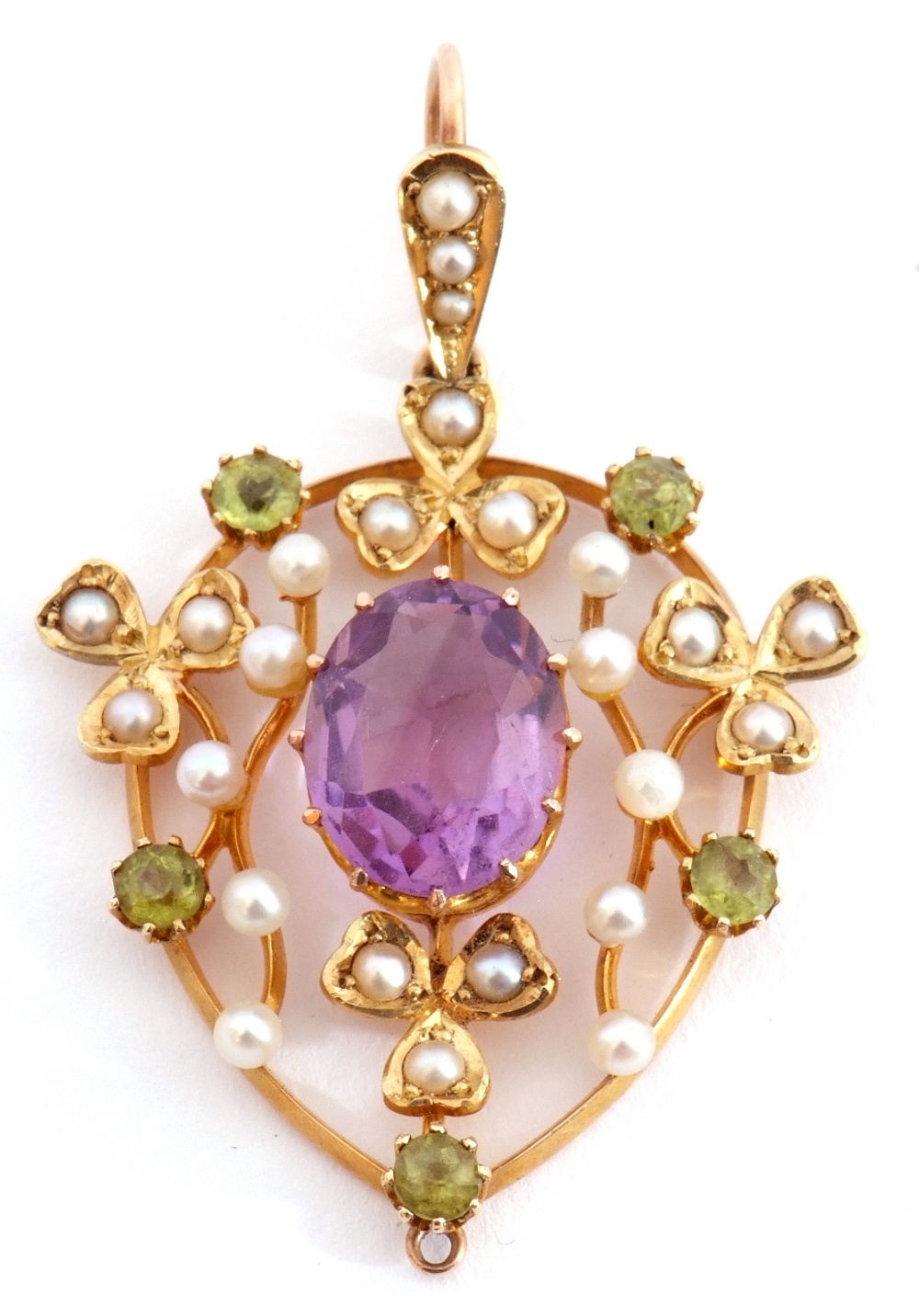 Amethyst, peridot and seed pearl open work pendant centring an oval multi-claw set faceted