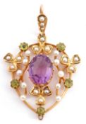 Amethyst, peridot and seed pearl open work pendant centring an oval multi-claw set faceted