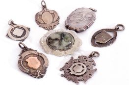 Mixed Lot: four hallmarked silver fobs, a white metal example, together with a sterling marked