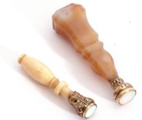 Mixed Lot: 19th century agate seal, together with an antique carved ivory handled example, both with