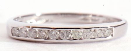 9ct white gold and diamond half-hoop ring, featuring 10 small round single cut diamonds, channel