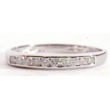 9ct white gold and diamond half-hoop ring, featuring 10 small round single cut diamonds, channel
