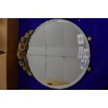 CIRCULAR MIRROR WITH FLORAL DESIGN ABOVE