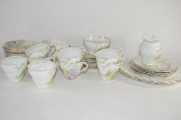 PART TEA SET SOLD BY SALISBURY CHINA IN THE ARCADIA PATTERN, COMPRISING 10 CUPS, SAUCERS, SIDE